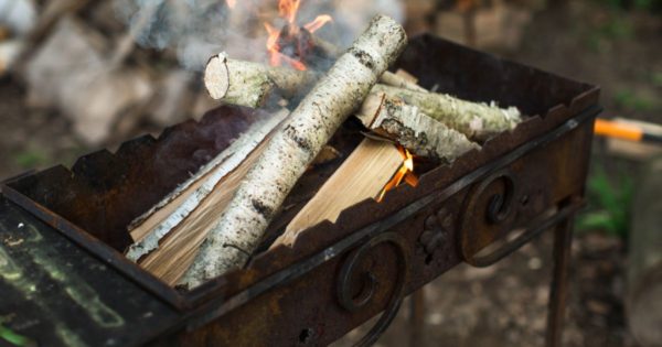 burning wood on grill